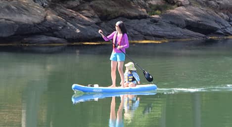 Come Visit Mount Desert Campground! woman kayaking in bar harbor maine